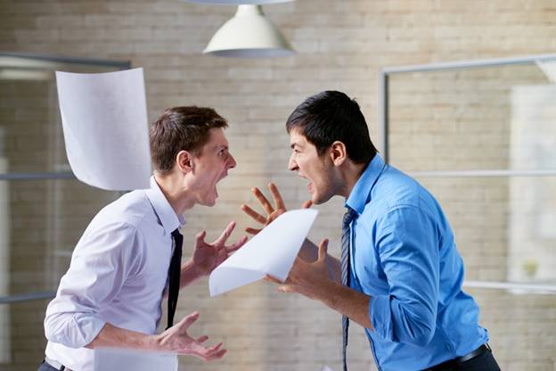 Men yelling at each other in office - Hostile Work Environment